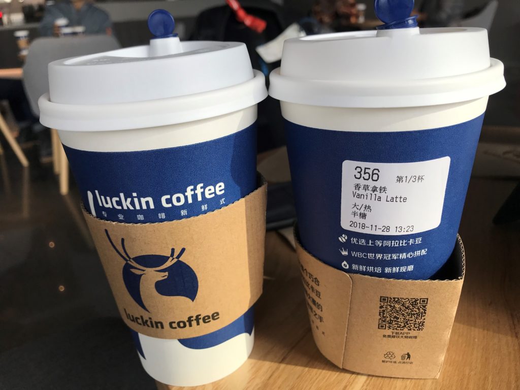 Luckin Coffee Cups with stickers on them showing order details