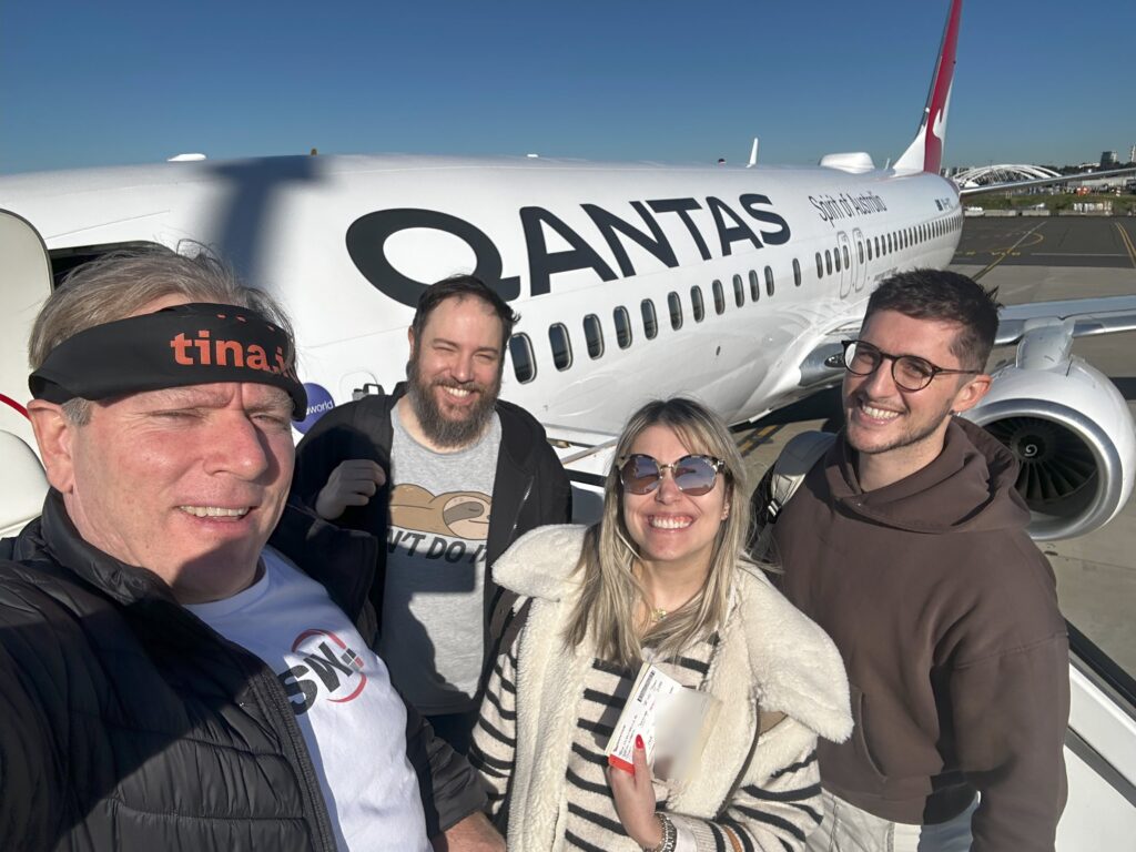 Group in front of a plane